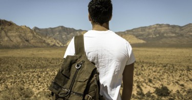 Photo of a person of color with a backpack
